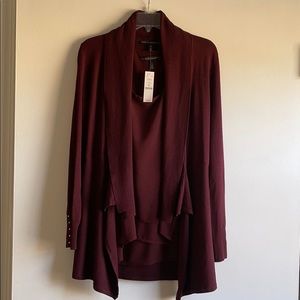 Burgundy sweater/cardigan. Brass details on cuff